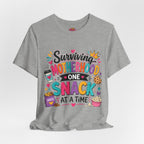 Motherhood Snack T‑Shirt — "Surviving Motherhood One Snack at a Time" Mom Tee