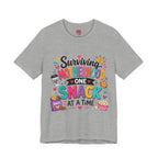 Motherhood Snack T‑Shirt — "Surviving Motherhood One Snack at a Time" Mom Tee